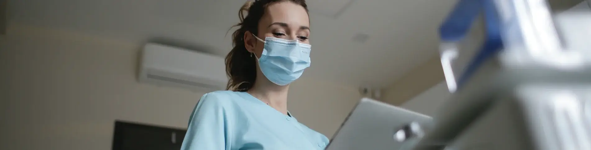 Nurse keeping up with her training using online courses in health and social care
