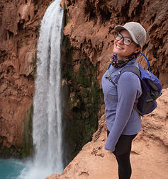 Standing over the blue waters at Havasu Falls