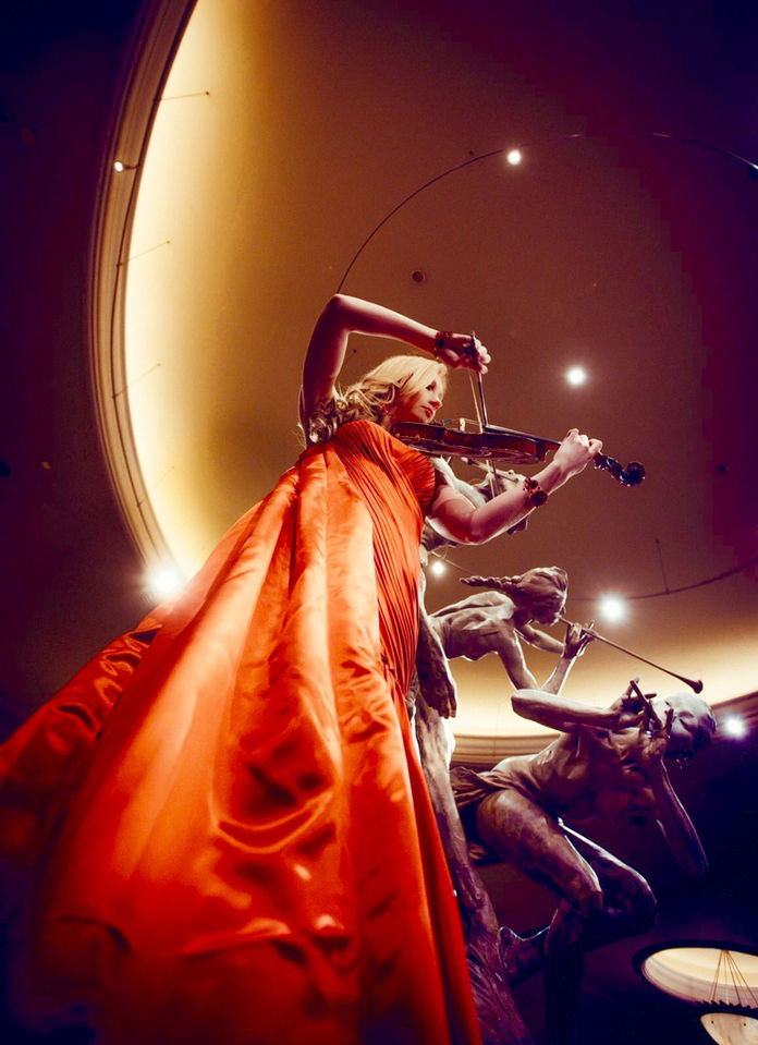 Live musicians performing at a luxury event featuring bands, DJs, violinists, and entertainment experiences