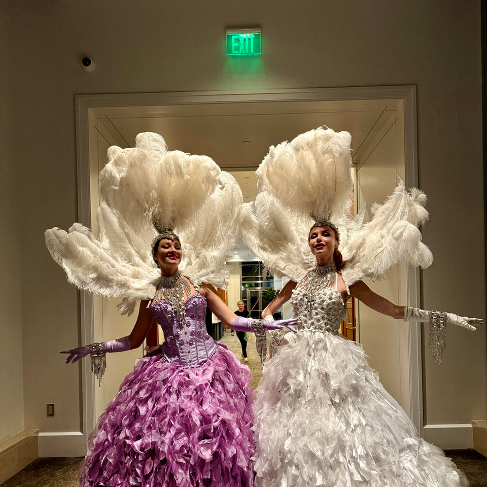 Interactive entertainment performers creating immersive experiences at a luxury event