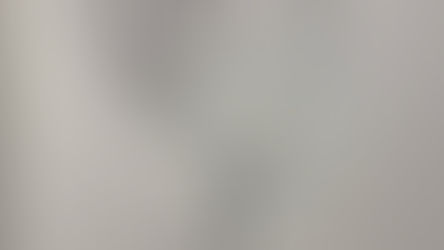 Black ink sketch of a rose with spiraling lines, on an off-white paper. Text "1/10" in the corner. Background is dark and textured.