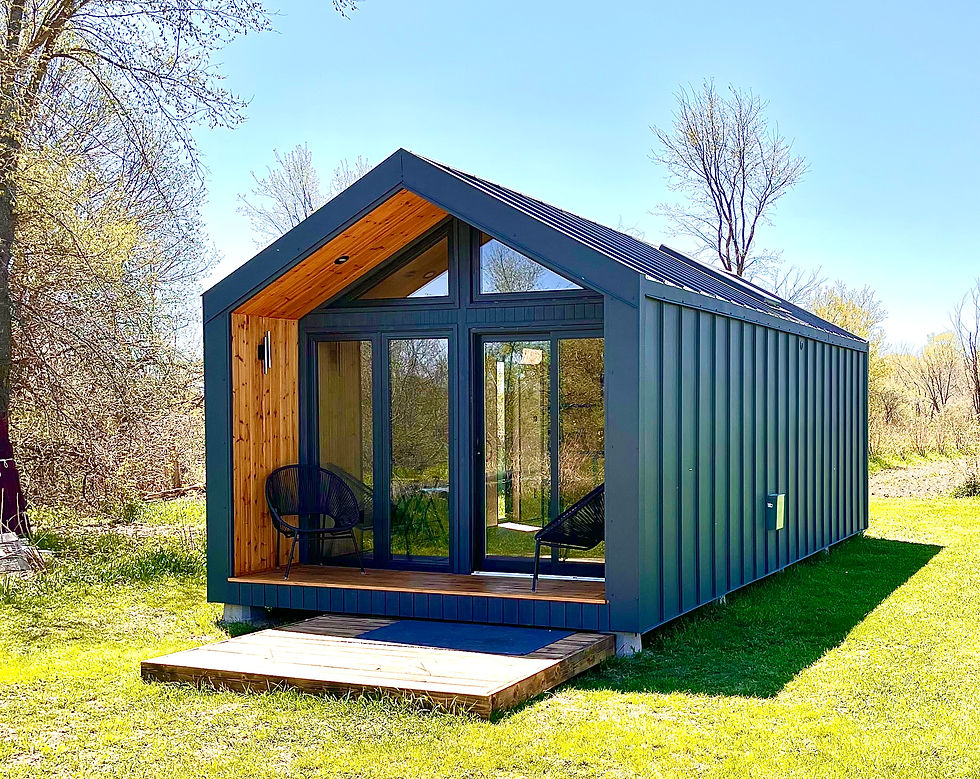 Eye-level view of a modern tiny house cabin in a serene location