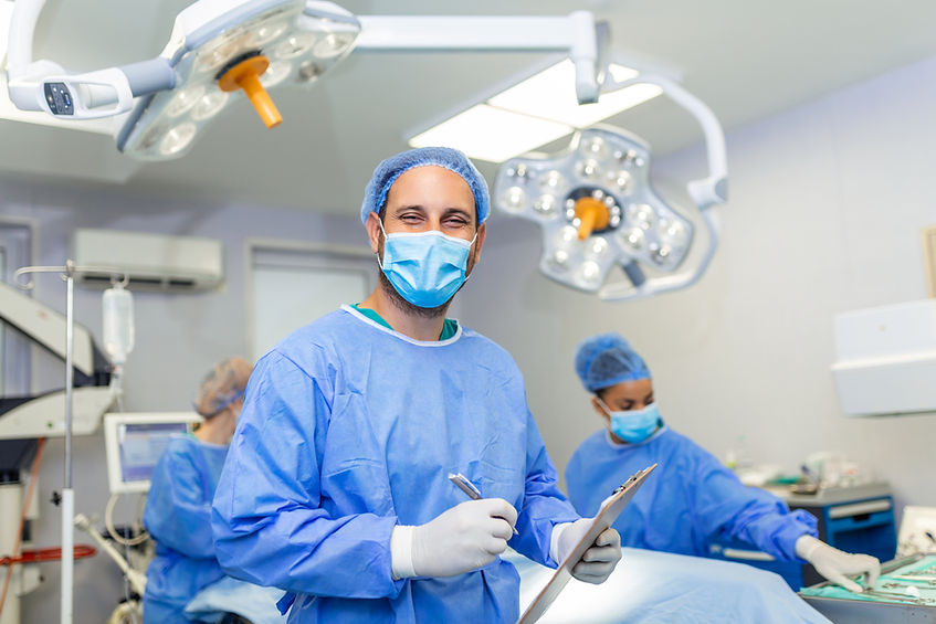 surgeon-writing-clipboard-operation-room-anaesthesiologist-writing-updates.jpg