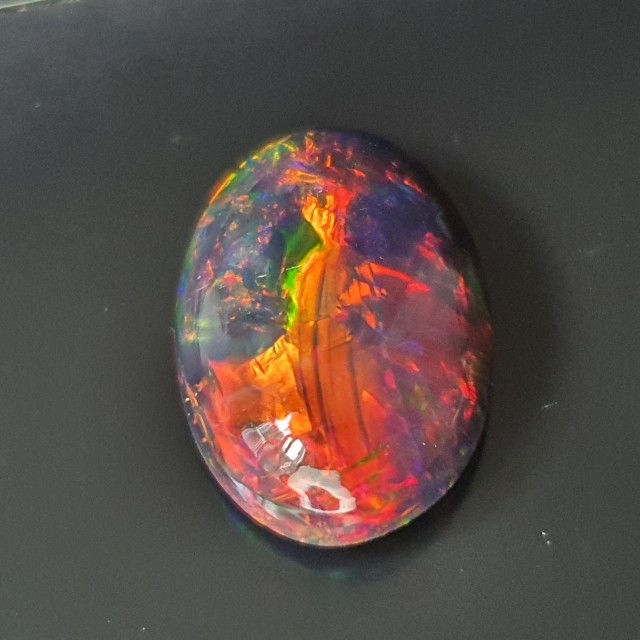 Thumbnail: 6.07 ct Natural Opal black with amazing playoff color oval loose gemstone