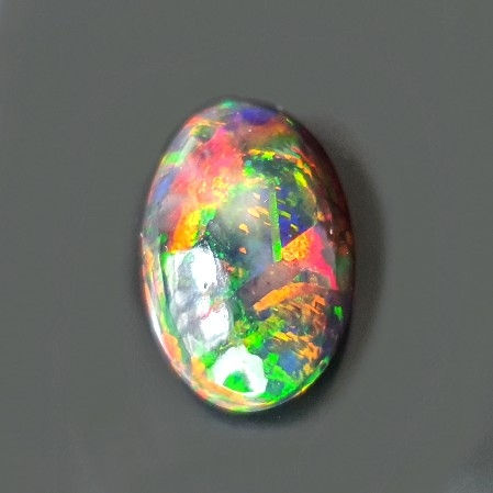 10.84 ct Natural Opal black with amazing playoff color oval loose gemston
