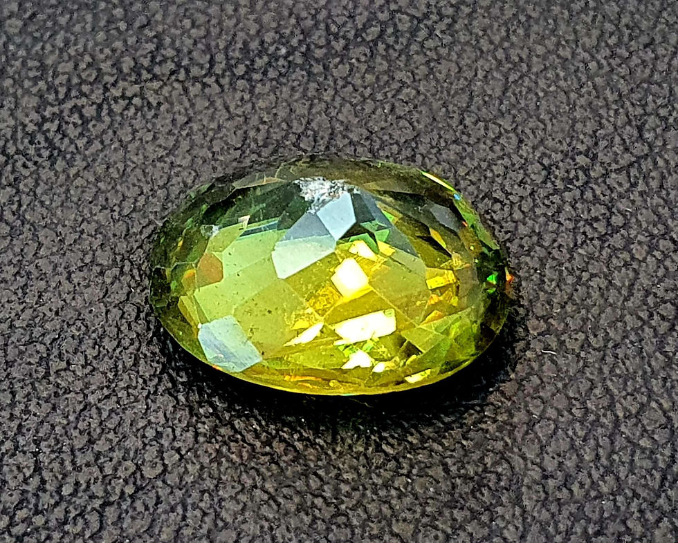 Miniatura: Natural Sphene 5.65 ct, 12.4 x 9.8, oval gemstone