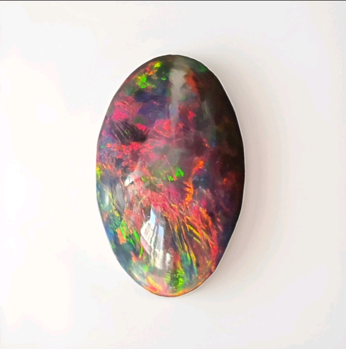 10.84 ct Natural Opal black with amazing playoff color oval loose gemston