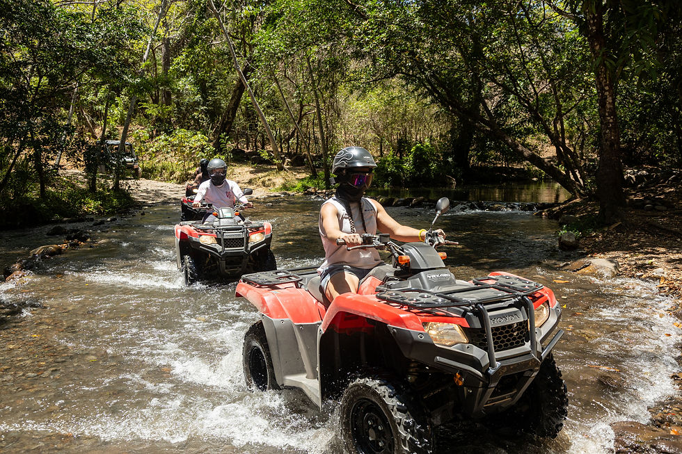 Eye-level view of a Honda ATV parked near La Leona Waterfall in Rincón de la Vieja