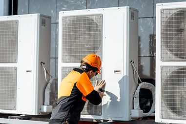 workman-installing-outdoor-unit-of-the-air-conditioner-e1621836841610.jpg