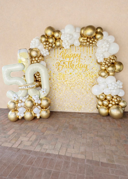 Gold and white organic balloon garland arch framing a shimmer wall backdrop with Happy Birthday sign and jumbo 50 balloons by Phenomenal Touch NC in Raleigh, Garner, Clayton, Holly Springs, Fuquay Varina, North Carolina.
