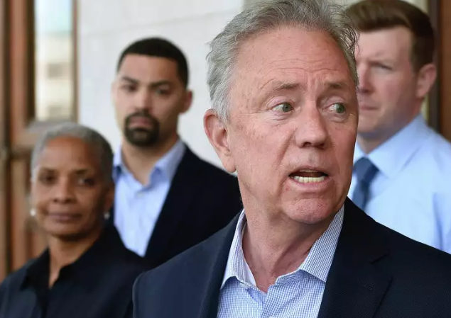 Governor Ned Lamont, center, spoke Wednesday at the Newington headquarters of the Connecticut Humane Society to discuss the link between animal cruelty and child abuse. Arnold Gold/Hearst Connecticut Media