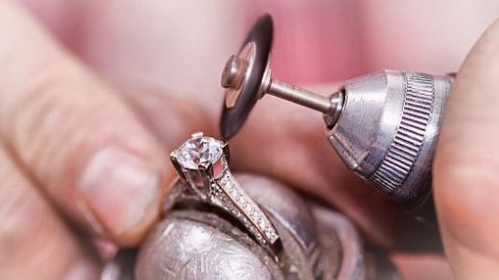 High angle view of a jeweler crafting a custom diamond ring