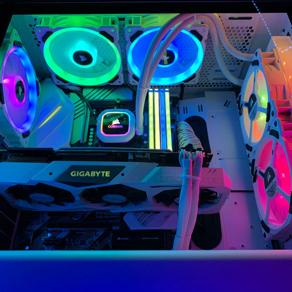 Inside high-performance gaming PC case with GIGABYTE GPU and vibrant RGB lighting.