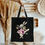 Thumbnail: Black canvas tote with classic illustration of White Rabbit. Perfect for fans of  Alices Adventures in Wonderland