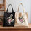 Thumbnail: Black and natural canvas tote with classic illustration of White Rabbit. Perfect for fans of  Alices Adventures in Wonderland