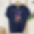 Navy tee with illustration of Colorful Stack of Books. Personalize with name of bookstore.