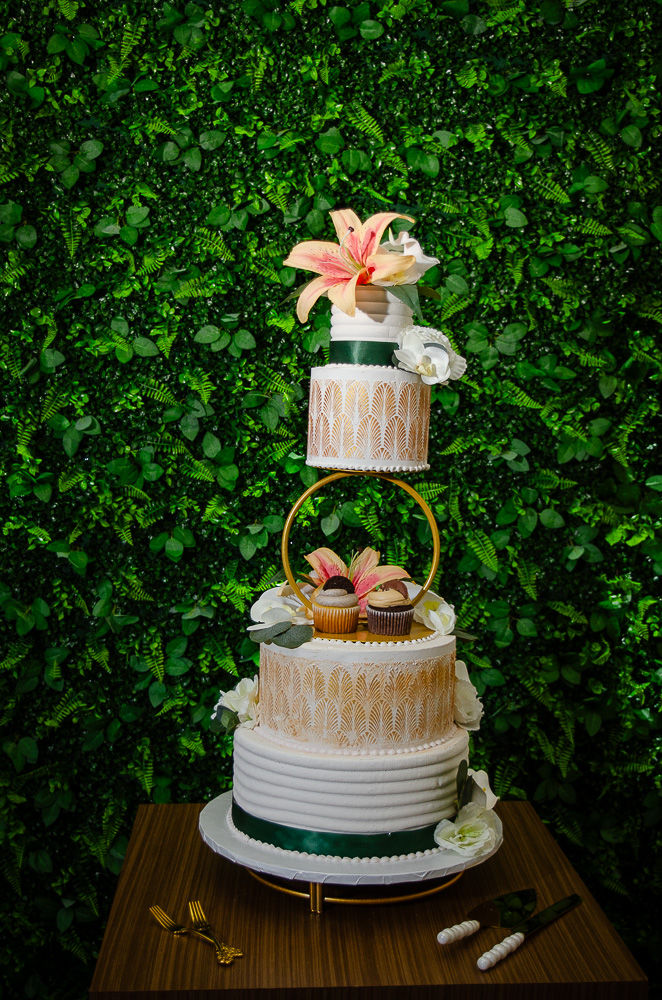 Double sided cake by Storybook Delights. Greenery Wall LuxElite Services