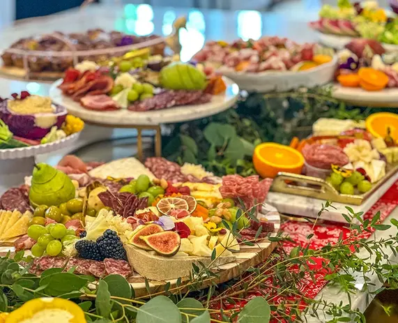 Assorted grazing tables with meats, cheeses, and fruit - best charcuterie columbus ohio