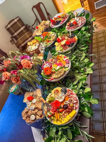 Assorted grazing tables with meats, cheeses, and fruit - best charcuterie columbus ohio