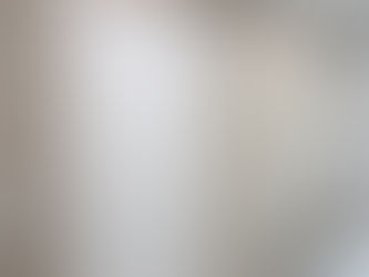 Elegant Miami powder bathroom with textured Eclipse TWC30609 wallpaper and patterned floor tiles by The Wallpaper Company