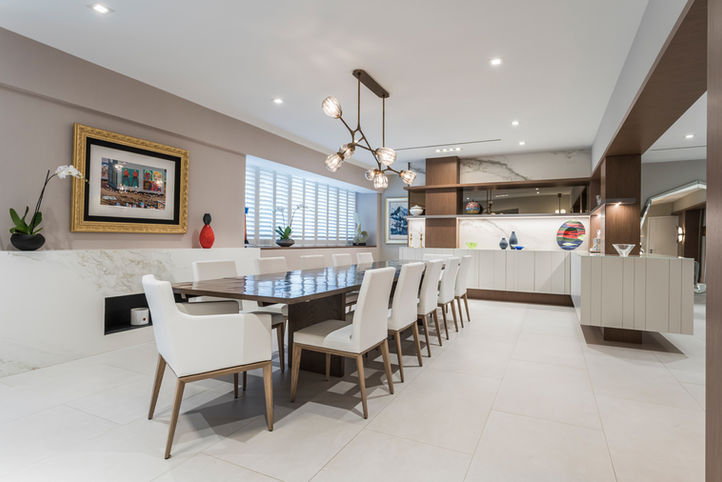 Modern dining room with long table and white chairs