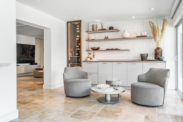 Modern living room with grey armchairs and built-in shelving