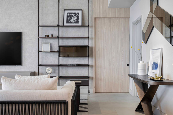 Modern apartment interior: shelves, sofa, console table