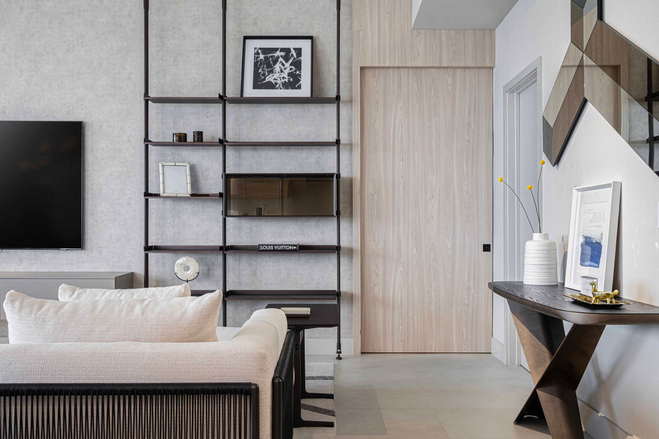 Modern apartment interior: shelves, sofa, console table