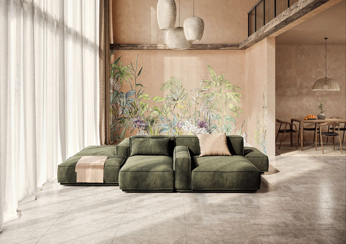 Spacious living room with green sofa, tropical mural, and large windows. Beige walls and pendant lights create a calm, airy atmosphere.