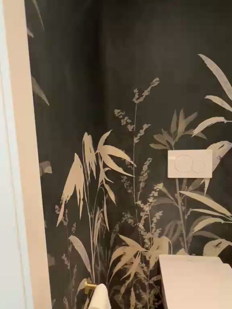 A video walkthrough of a Grove Isle, Miami bathroom foyer renovation featuring a custom botanical mural from the Guimar Urbina Home Dress Your Wall collection, printed on high-performance canva backing.