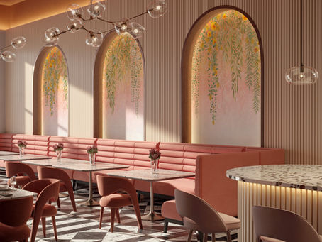 Chic cafe with pink seating, floral wall art, and geometric floor. Modern lighting adds elegance. Tables feature single flower vases.