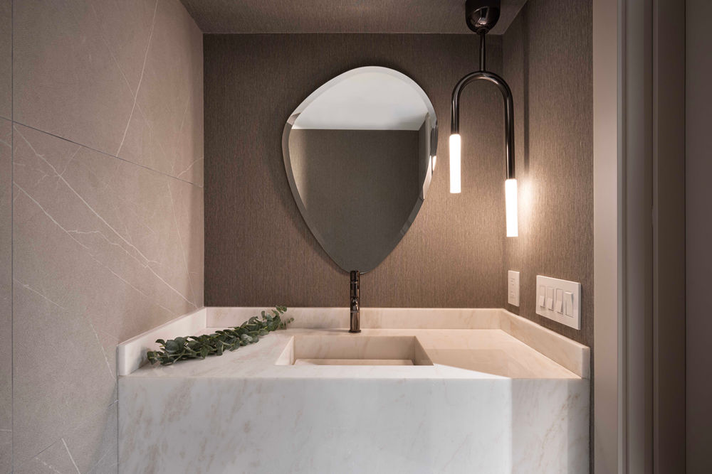 Modern powder room sink with unique mirror