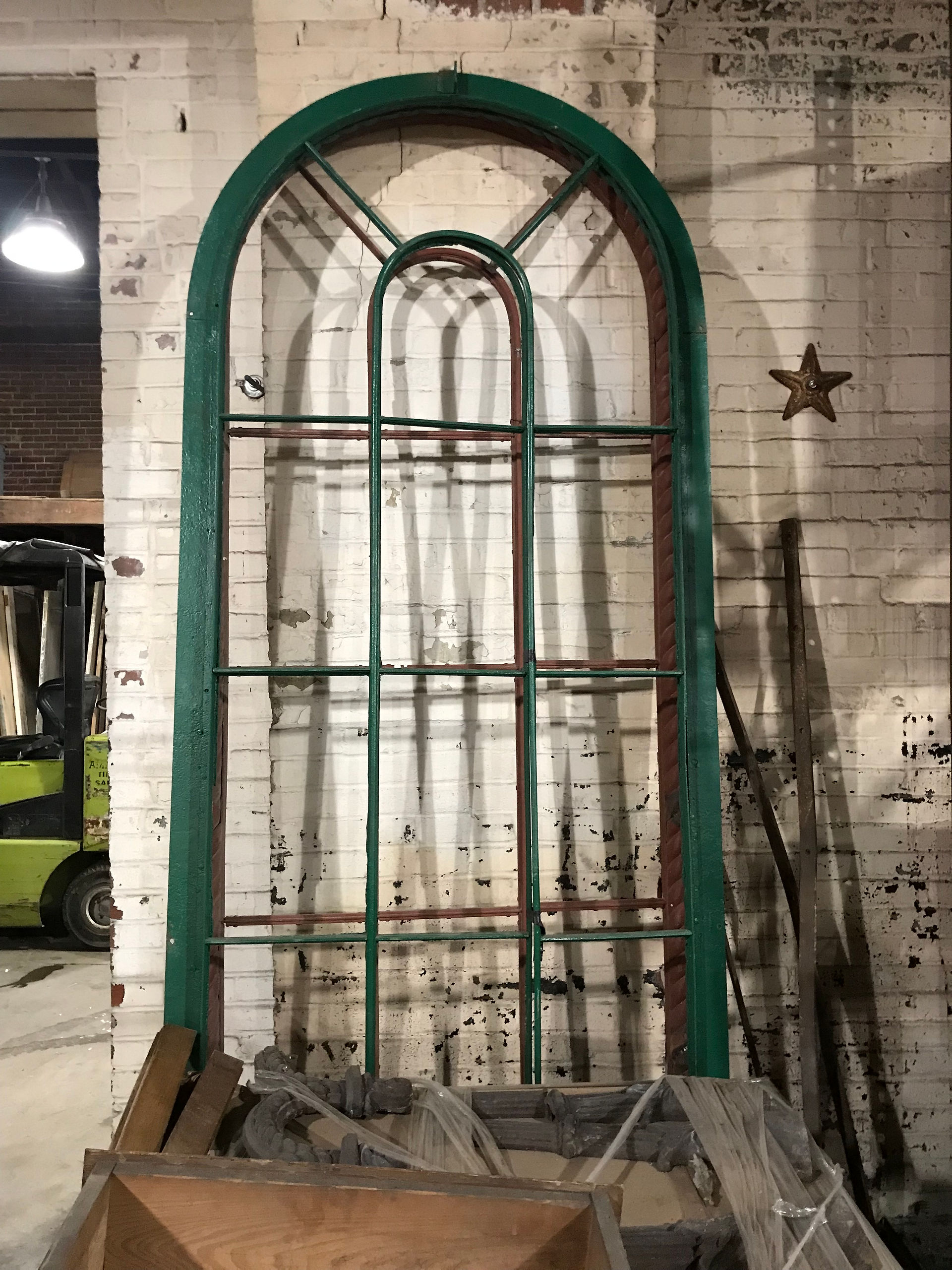 Iron Store front: Bronson Hide Building arched metal window frames.