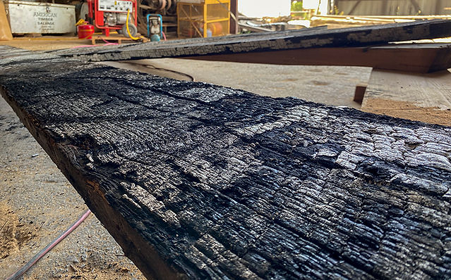 The burnt face of a piece of lumber from the Servco Building in St. Louis MO.
