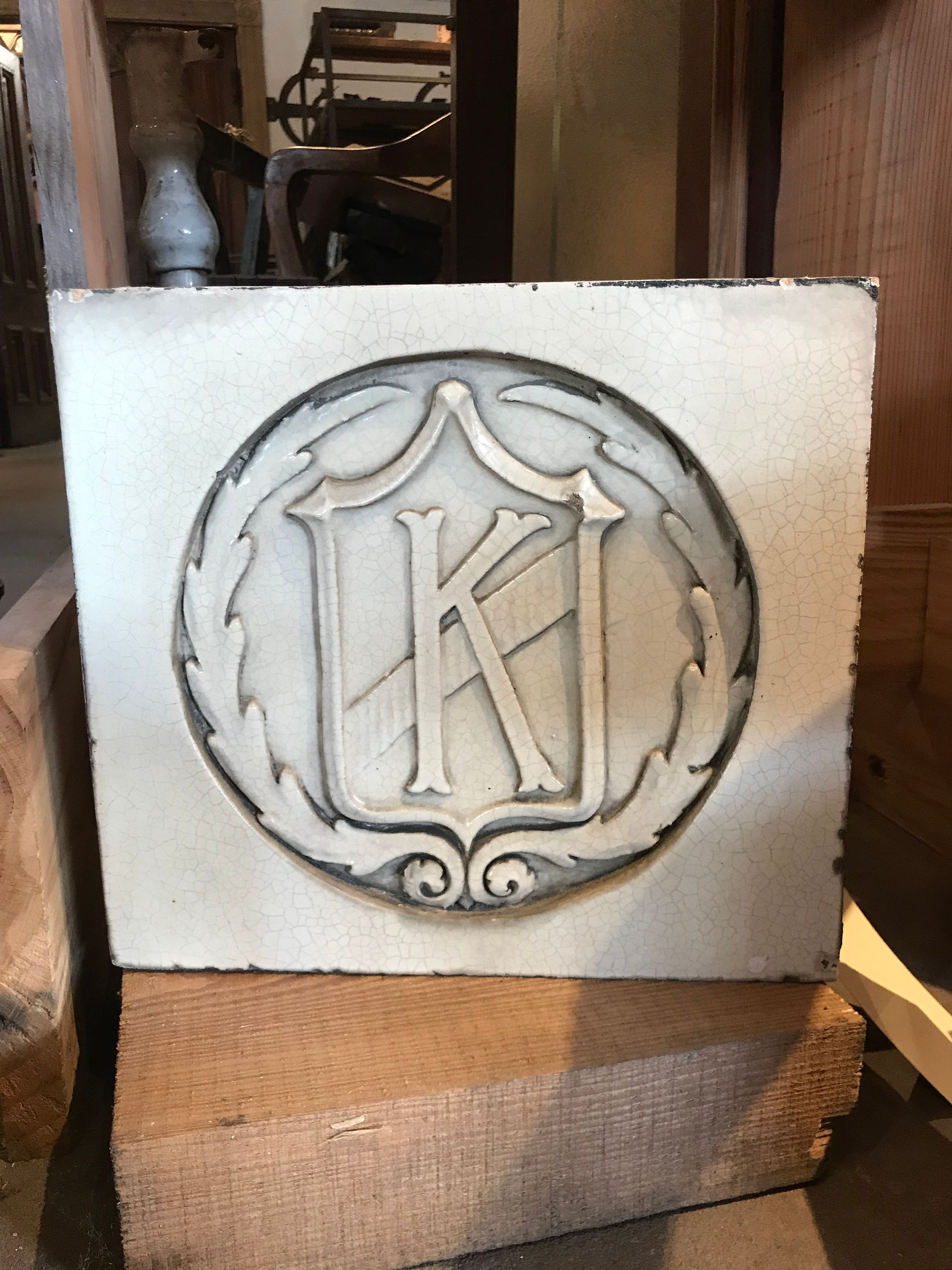 Cast terra cotta block with the initial K for Kingsland Movie Theatre.