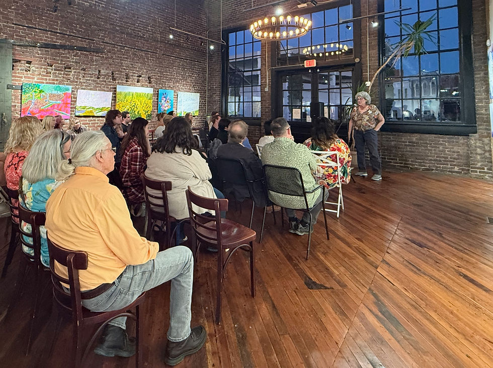 Nancy Fischman welcomes participants to Fischman Gallery in downtown Johnson City during the Oct. 9 poetry contest and pub crawl.