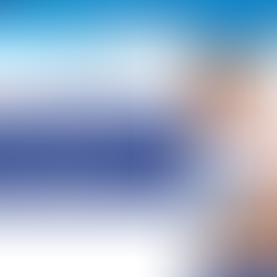 Healthcare worker assisting a patient. Text reads "Ultimate guide to ICD-10-CM Codes F01-F99." Blue and white geometric design.