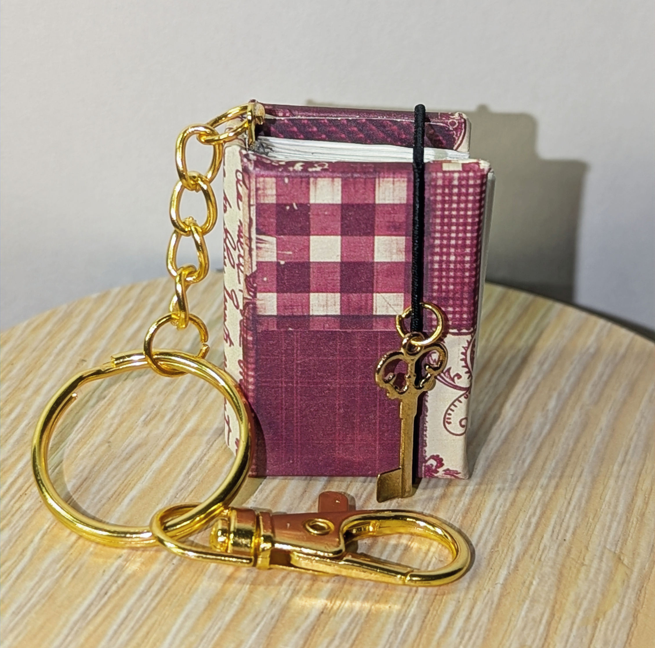 Burgundy patchwork tiny blank journal keychain with key charm and gold hardware, 1.5 x 1 inch