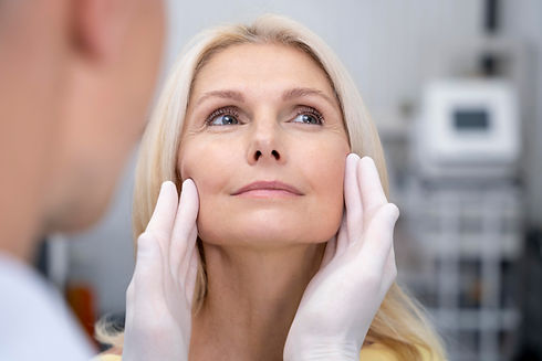 Consultation: Doctor examining patient's face