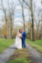 Bride and groom kissing on farm in New Jersey