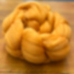 “Marigold" fine merino wool top approximately 3 inch staple 4 oz  braid