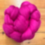 “Raspberry" fine merino wool top approximately 3 inch staple 4 oz braid