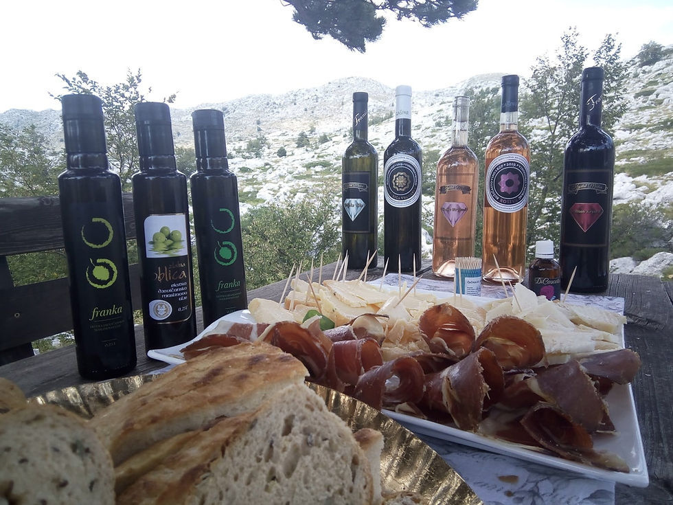Enjoying the meal in the mountains: Olive oil, wine, cheese, prosciutto and homemade bread