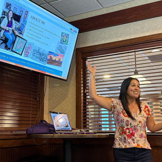 woman with dark hair and presentation screen
