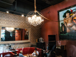 chandelier on ceiling with cherub and mirror