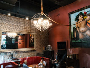 chandelier on ceiling with cherub and mirror