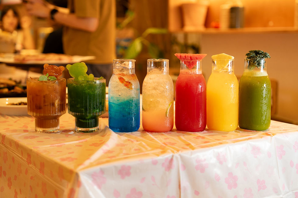 a line of colourful drinks