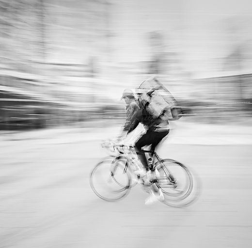 black and white abstract fine art wall art icm photography and multiple exposure photography , capturing the dynamic motion of cyclist in Oslo city by Douglas Carr Photography with Fuji GFX100Sii