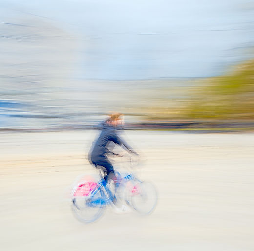 a abstract modern fine art wall art minimalistic icm photography of a cyclist cycling through the Oslo city by Douglas Carr Photography taken with Fuji GFX100Sii