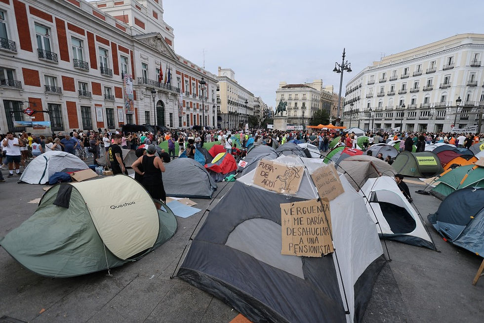 A protest encampment fills Madrid's Puerta del Sol square as public outrage grows over the high-profile eviction of Maricarmen Abascal.
